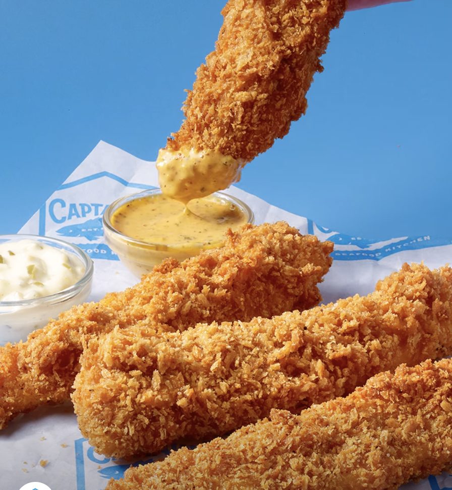 Panko tenders dipped in sauce over Captain D’s branded paper