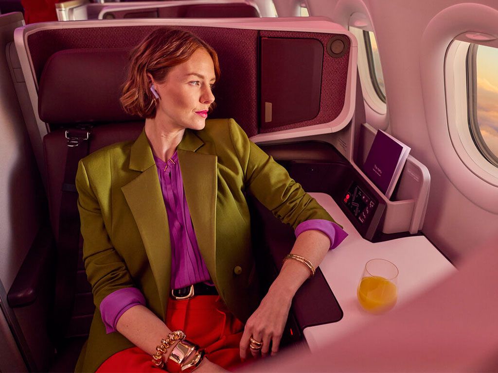 A traveler in an airline business class suite